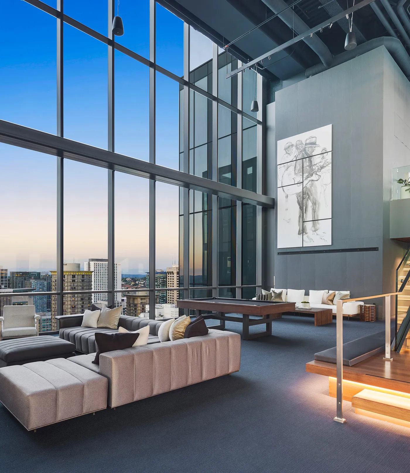 Penthouse window wall hand-blended so the room and the view outside are both correctly exposed