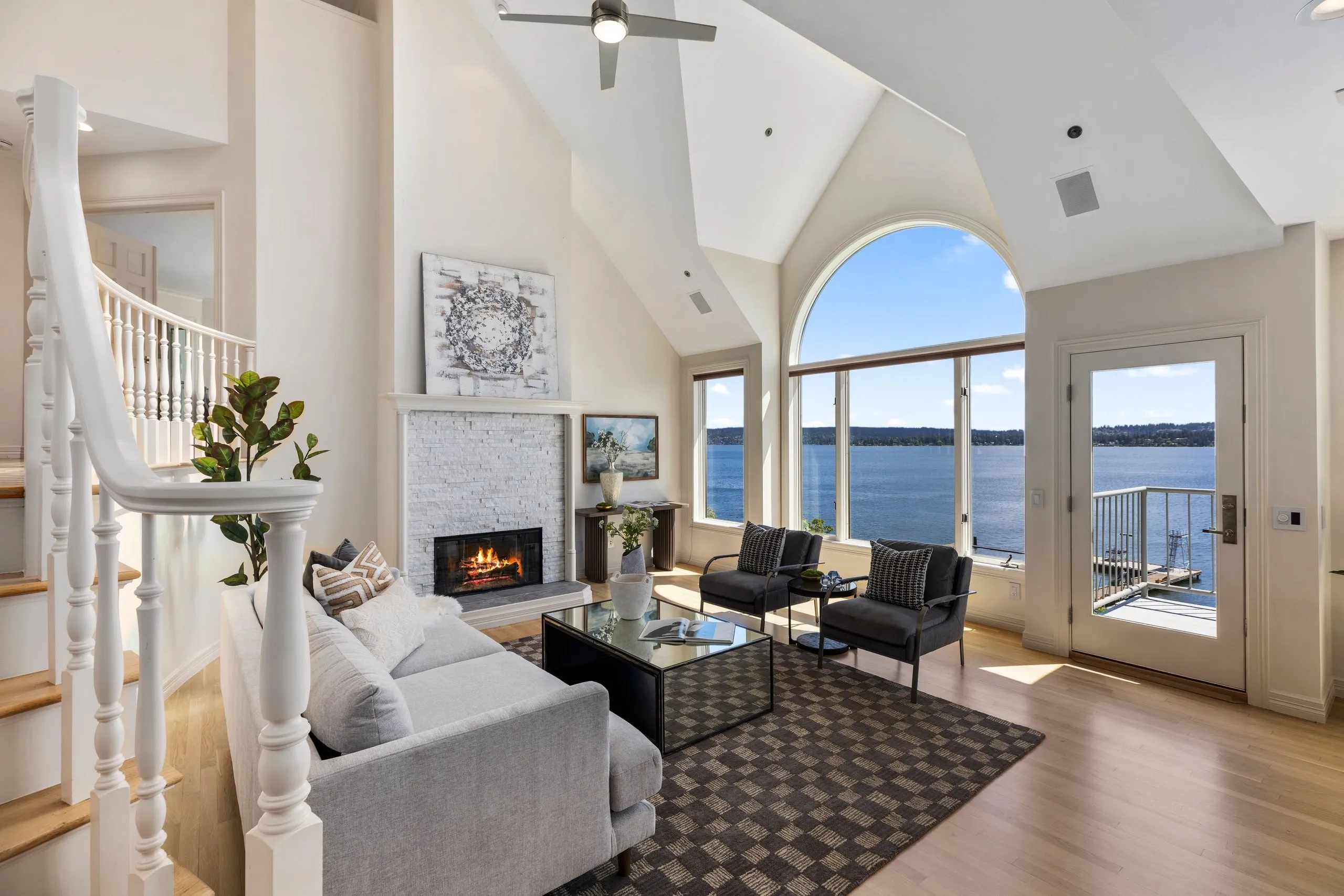 Vaulted ceiling and chandelier in a luxury home photographed by ACRE Seattle