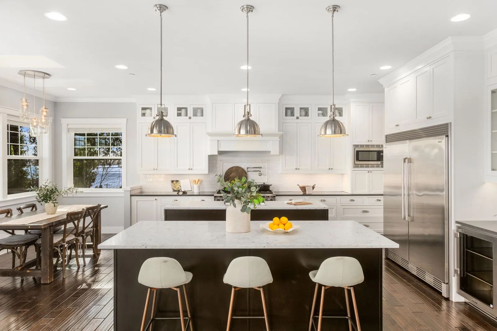 White kitchen with pendant lights over the island