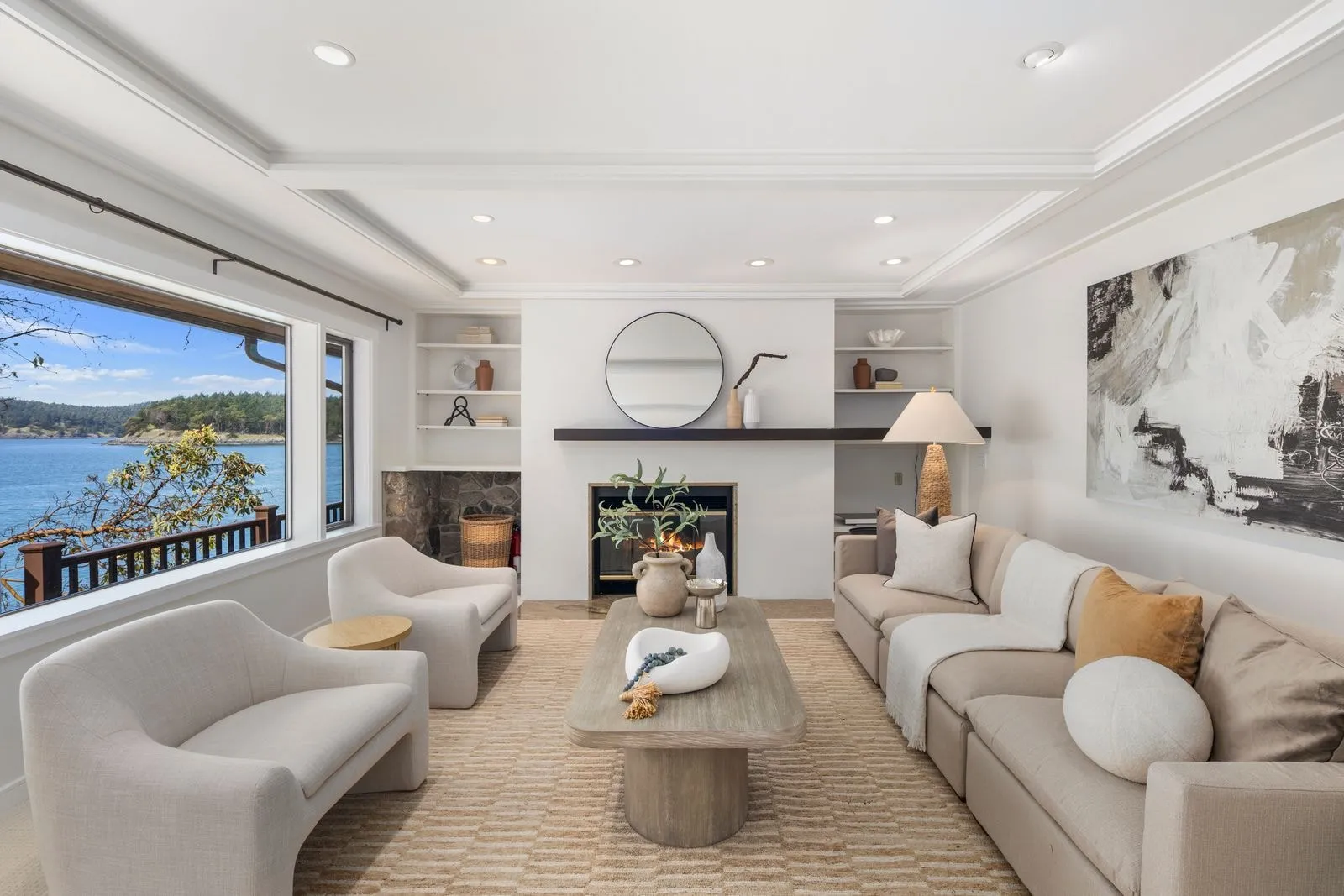 Living room with a fireplace and a view, photographed by ACRE Seattle for a luxury listing