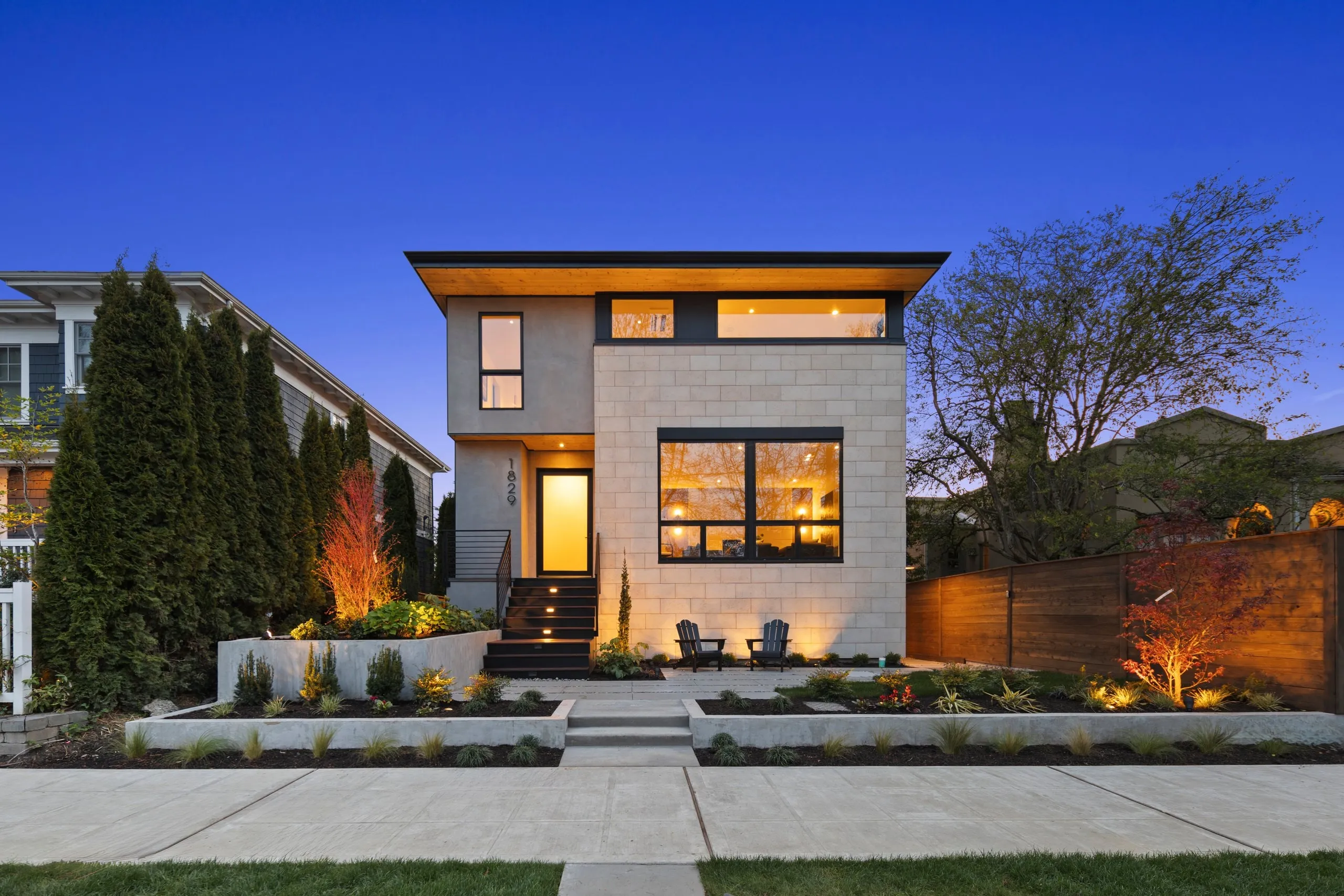 Modern new-construction build photographed at twilight by ACRE Seattle