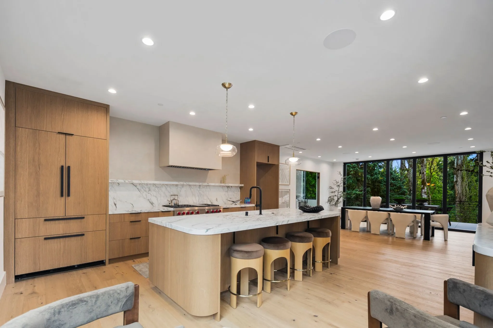 Open kitchen flowing into a great room, photographed by ACRE Seattle
