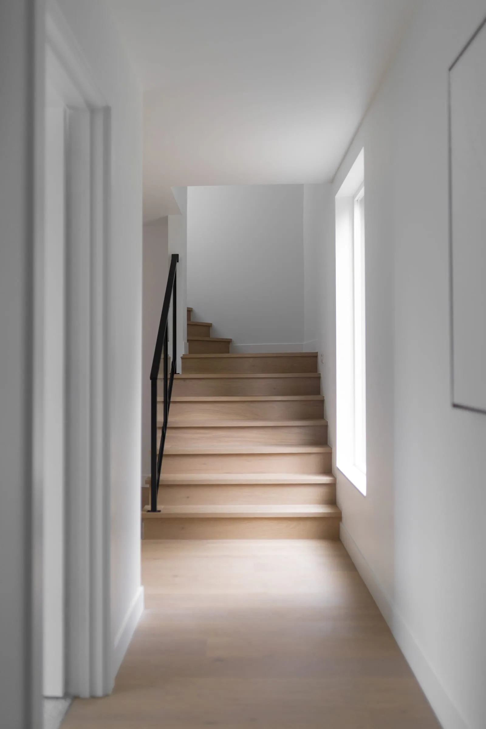 Empty stair hall in a vacant listing, the kind of bare space buyers struggle to read
