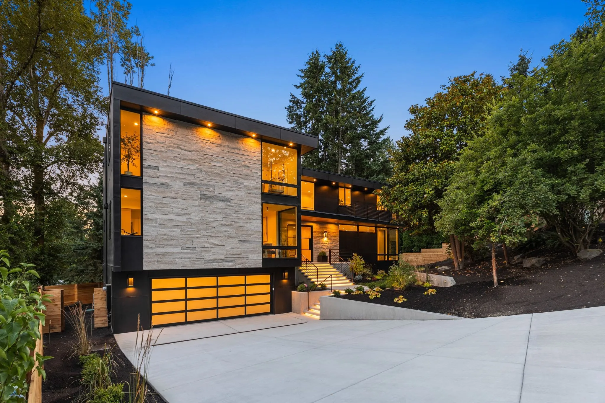 Modern facade glowing at dusk, photographed by ACRE Seattle for a twilight set